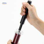 Ergonomic wine opener styled with red wine bottle in elegant setting.