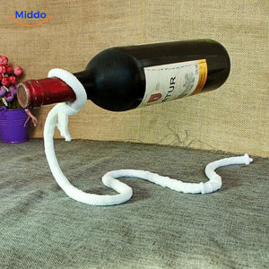 White rope wine bottle holder in home display setting.