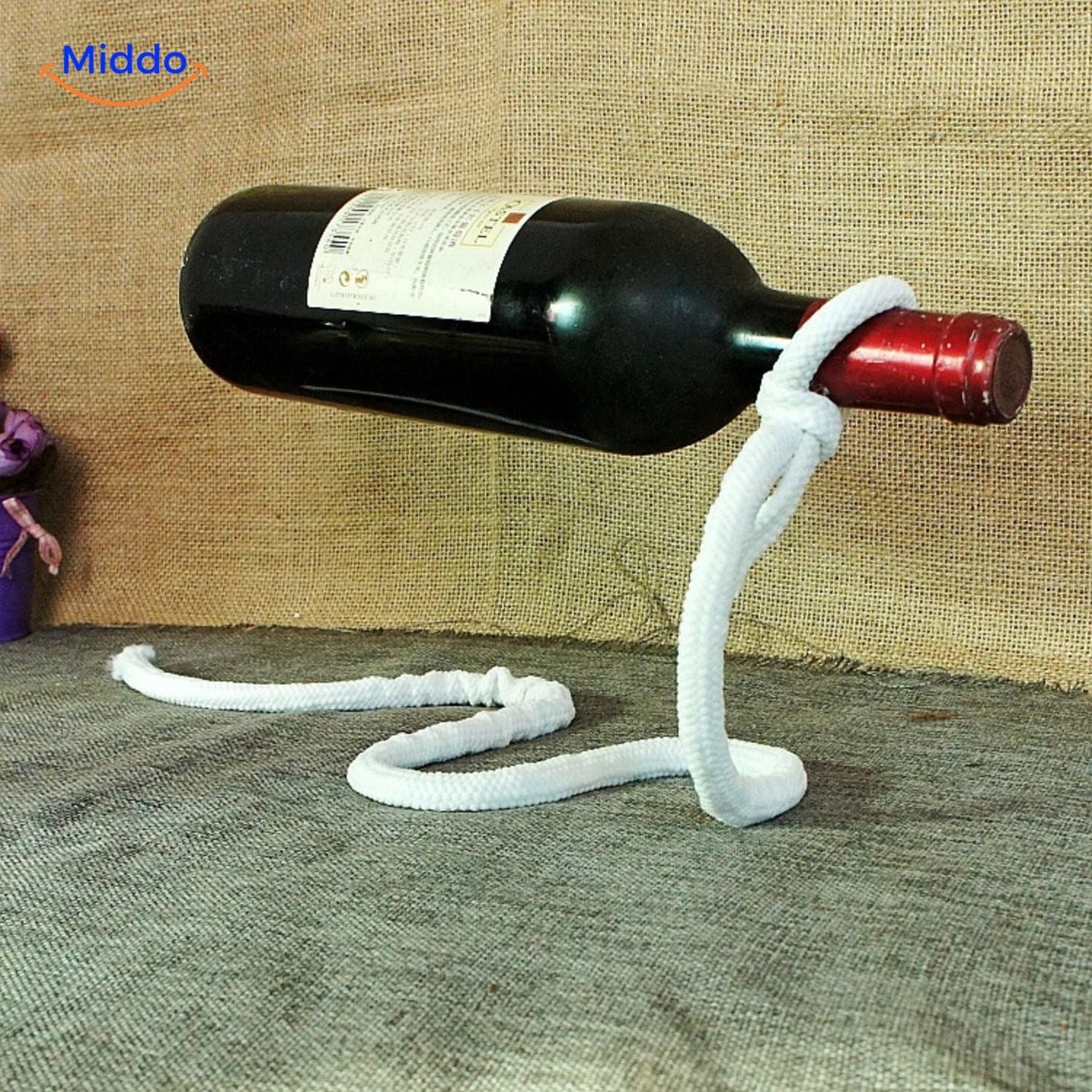 White rope wine bottle holder with elegant suspension.