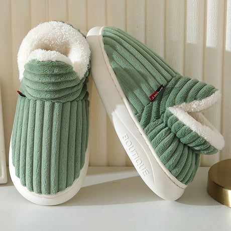 Green therapeutic slippers styled indoors, showcasing comfort and coziness for everyday wear.