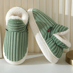 Green therapeutic slippers styled indoors, showcasing comfort and coziness for everyday wear.