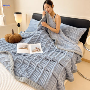Winterra throw blanket with ribbed texture in blue gray and soft fleece reverse