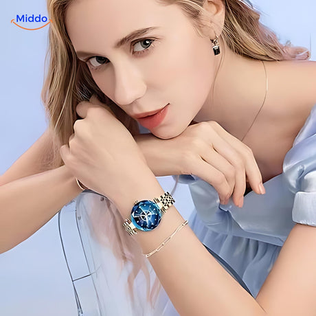 Women's elegance gold watch worn by a model, lifestyle fashion photo.