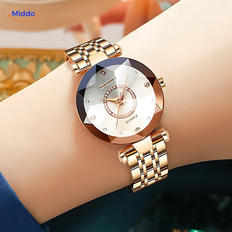 Elegance women's gold watch worn on a wrist, lifestyle close-up shot.