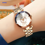 Elegance women's gold watch worn on a wrist, lifestyle close-up shot.