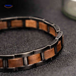 Flat lay detailed view of wooden bracelet showing texture and wood craftsmanship.