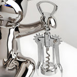 Close-up of the bear-shaped bottle opener mechanism on the rustic wooden wine holder.