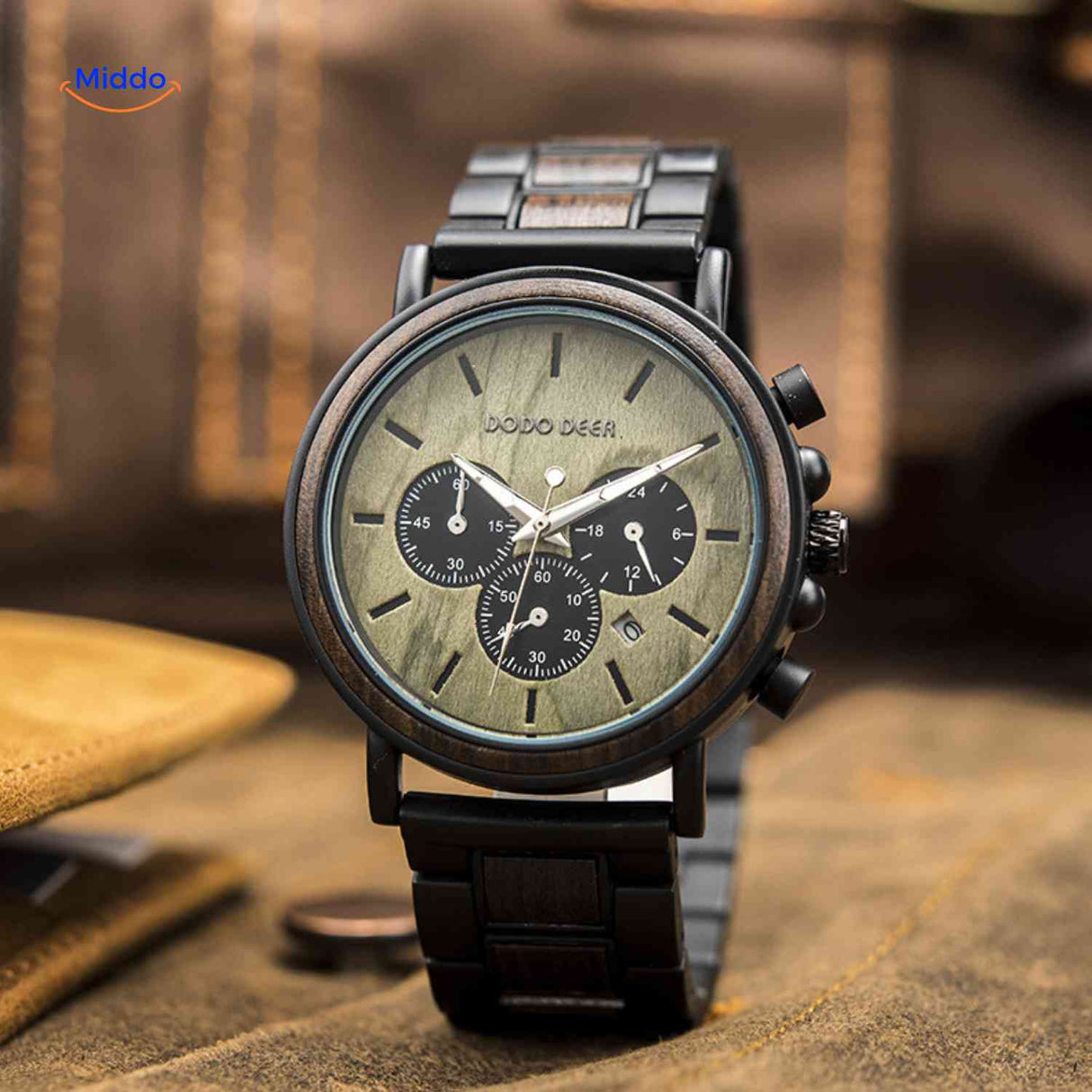 Wooden chronograph watch with green-tinted wood tone in closeup detail.