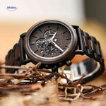 Wooden chronograph watch lifestyle closeup showing wood dial and chronograph dials.