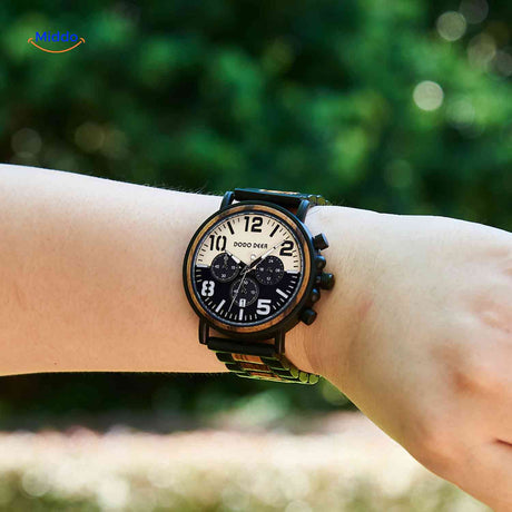 Wooden chronograph watch in natural light worn outdoors showcasing classic design.