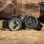 Two wooden chronograph watch variants displayed together showing color options.