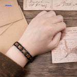 Wooden bracelet for men displayed on wrist showing proper fit and comfort.