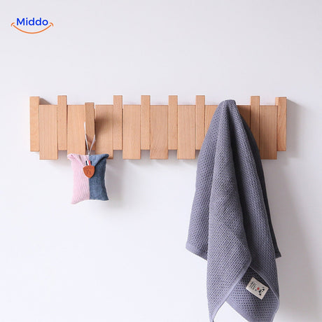 Piano coat rack mounted wall hanging solution for coats, bags, and accessories.