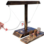 Ring toss game in action as player tosses ring toward wooden post.