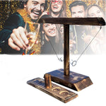 Wooden ring toss drinking game in festive party atmosphere setting.