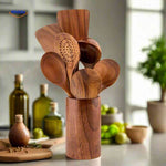 Wooden spoons and spatulas neatly organized in a teak wood utensil holder.