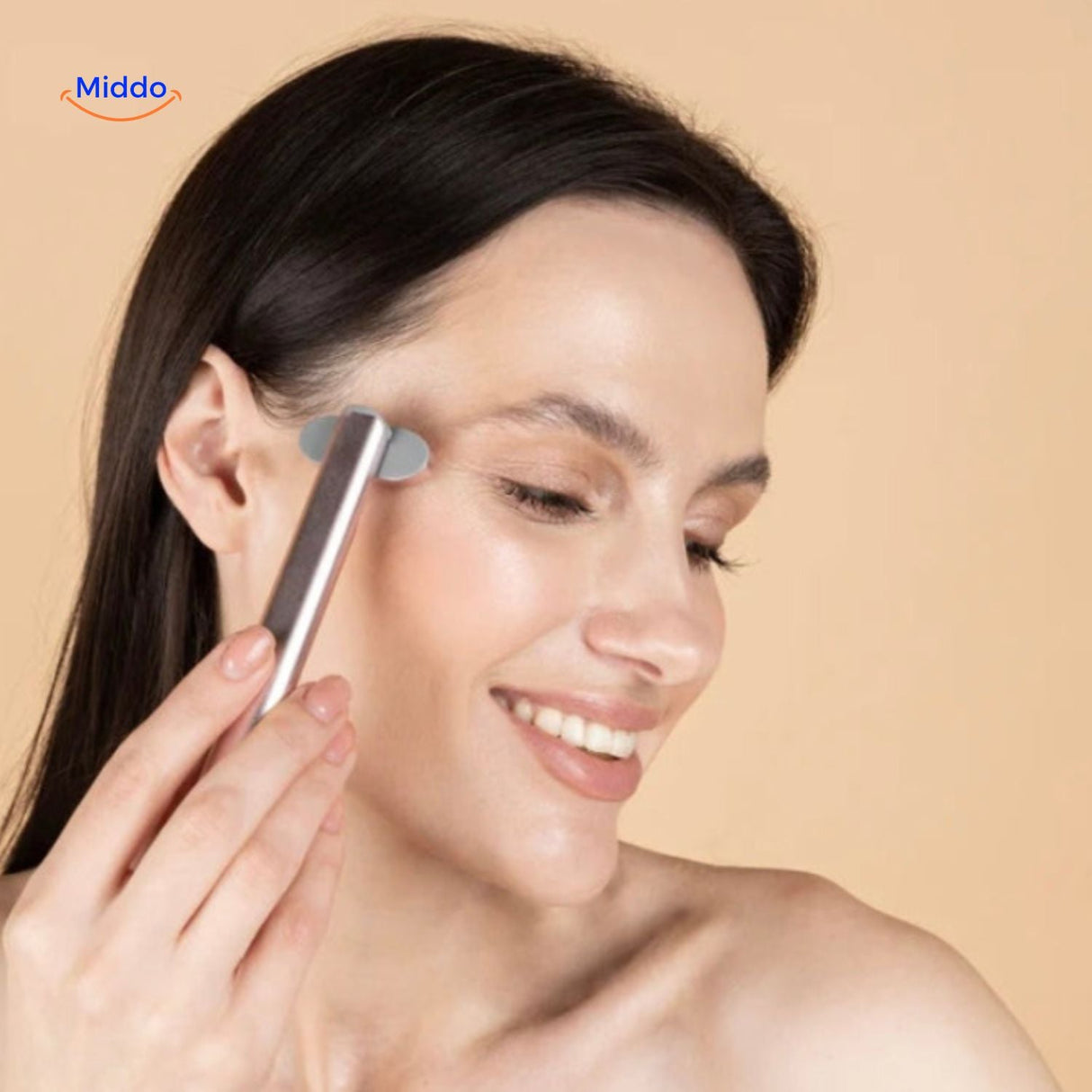 Anti-aging light therapy pen treating facial wrinkles with EMS technology at home.