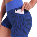 Blue high-waisted yoga shorts featuring breathable jacquard fabric and supportive fit.