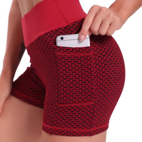 Red high-waisted yoga shorts featuring breathable jacquard texture and body-lifting support.