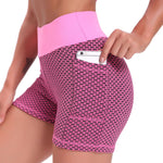 Rose pink high-waisted yoga shorts with breathable jacquard construction and flattering fit.