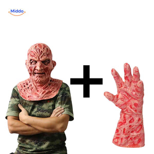 Burnt Zombiora mask held in a bare human hand for size reference.