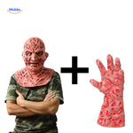 Burnt Zombiora mask held in a bare human hand for size reference.