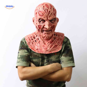 Side view of person in camo shirt wearing realistic Zombiora mask.