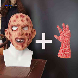 Zombie mask with red accents held by a bare hand without claws.
